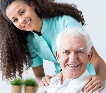 caretaker working with a senior in residential care homes